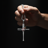 Male hand dangling - dark spotlight