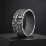 Hand-carved stone cross ring carries His gentle protection