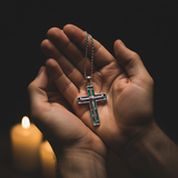 Two hands cradling - candlelight prayer